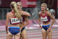 Courtney Frerichs, left, of the United States, is congratulated by teammates Emma Coburn, and Valerie Constien, right, after the final of the women's 3,000-meters steeplechase at the 2020 Summer Olympics, Wednesday, Aug. 4, 2021, in Tokyo. (AP Photo/Matthias Schrader)