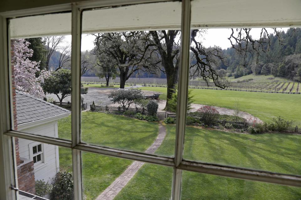 In this photo taken March 15, 2013 a view of vineyards at the MacMurray Ranch is seen from an upstairs window in actor Fred MacMurray's home in Healdsburg, Calif. The former cattle ranch, which was purchased in 1941 by the actor in the popular TV series "My Three Sons," now produces wine and is owned by the Gallo wine family. (AP Photo/Eric Risberg)