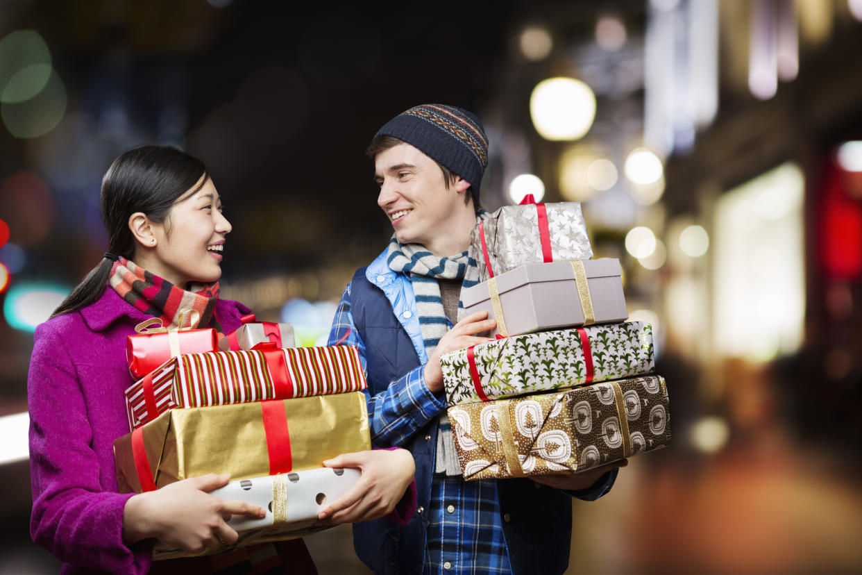 Couple with packages,shopping in city.