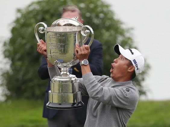 Morikawa’s only error of the day came when the lid fell off the Wanamaka Trophy (Getty)