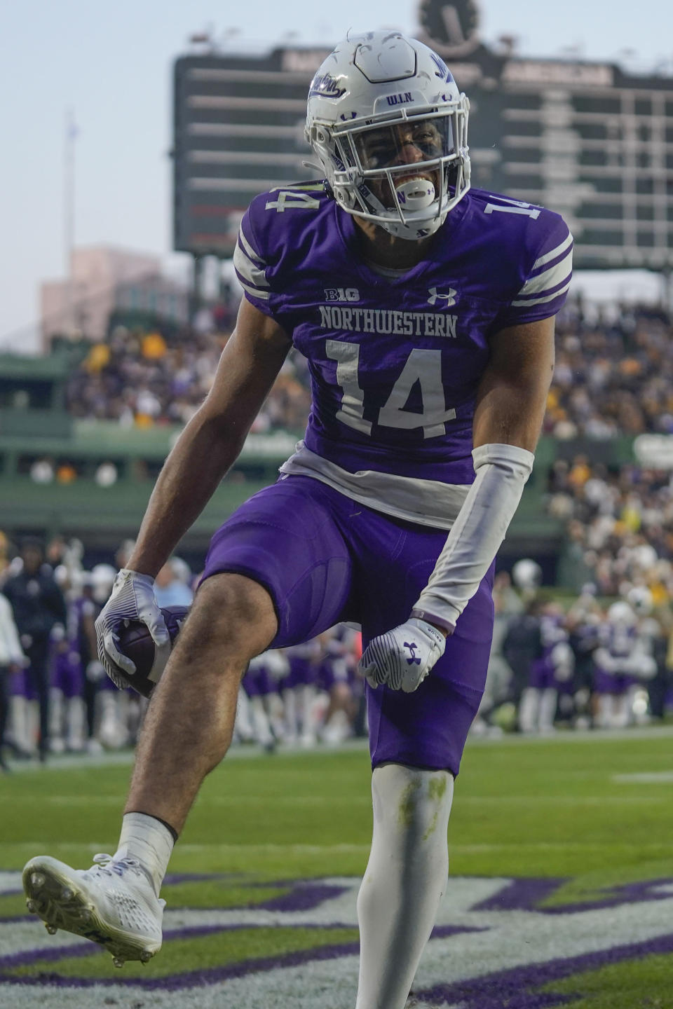 Northwestern wide receiver Cam Johnson celebrates after his touchdown during the second half of an NCAA college football game against Iowa, Saturday, Nov. 4, 2023, at Wrigley Field in Chicago. (AP Photo/Erin Hooley)