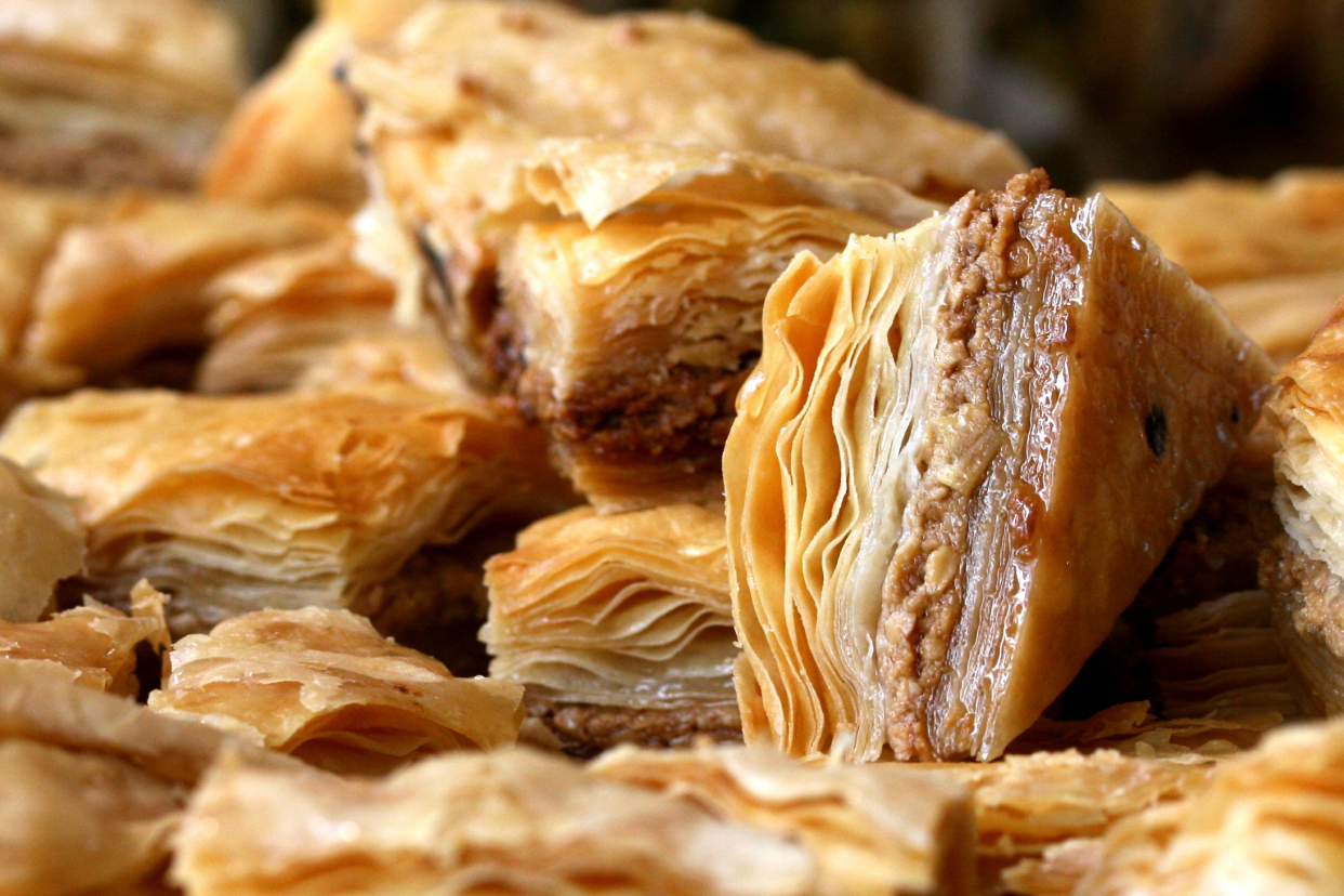 Several pieces of Greek Baklava piled together, selective focus