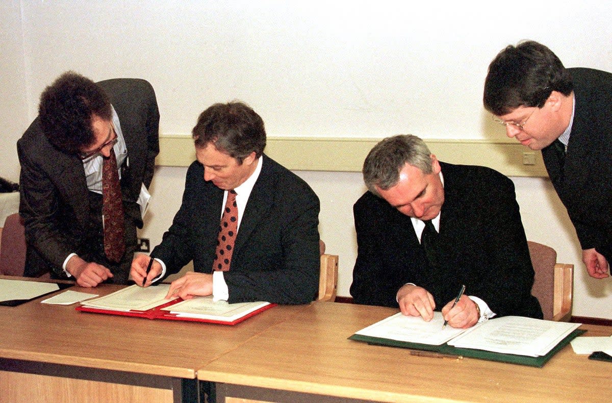 Tony Blair and Bertie Ahern sign the Good Friday Agreement (PA)