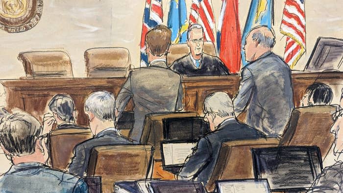 A courtroom sketch shows Dominion Voting Systems attorney Justin Nelson (standing left) and Fox News attorney Daniel Webb speaking to Judge Eric Davis before finishing jury selection in Delaware Superior Court in Wilmington, April 18, 2023.