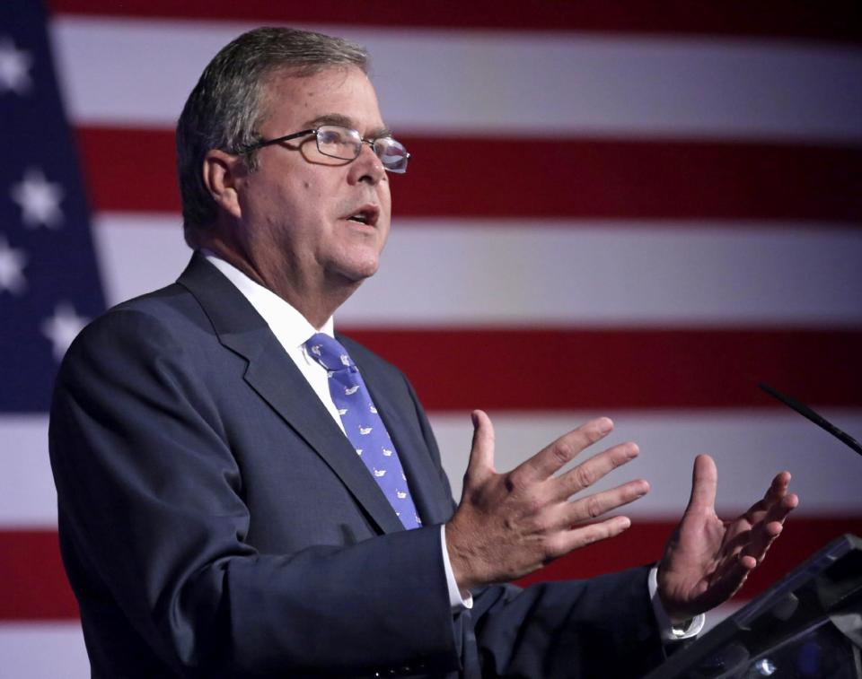 FILE - This Aug. 9, 2013 file photo shows former Florida Gov. Jeb Bush speaking in Chicago. Critics are relentless in warning about what they see as the folly of the new Common Core academic standards. The standards were written in private and never tested in real classrooms, they say. Educators aren’t familiar enough with the standards to use them. They’ll cost billions to put into place. (AP Photo/M. Spencer Green, File)