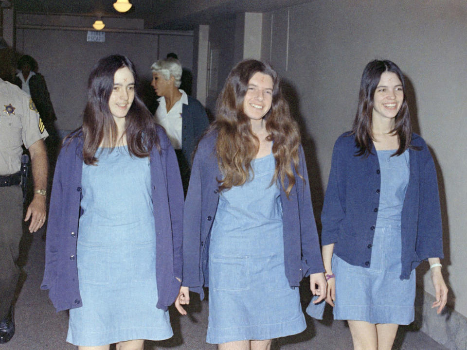 Susan Atkins, Patricia Krenwinkel and Leslie Van Houten, three of Manon’s followers, laugh as they arrive for trial