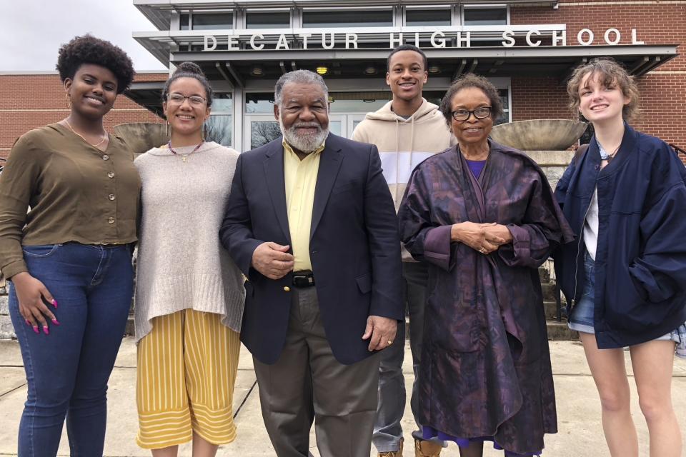 In this Feb. 13, 2020 photo, Students Genesis Reddicks, Liza Watson, Daxton Pettus and Emma Callicutt pose with Charles Black and Roslyn Pope outside Decatur High School in Decatur, Ga. Pope, who wrote "An Appeal for Human Rights" as a Spelman College student in March 1960, and Black, who co-founded the Atlanta Student Movement as a Morehouse College student that year, spoke at the school about their efforts to hasten the end of racial segregation in the South 60 years ago. (AP Photo/Michael Warren)