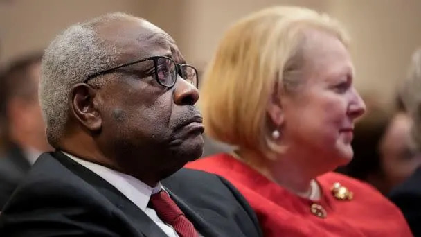 PHOTO: Associate Supreme Court Justice Clarence Thomas sits with his wife and Virginia Thomas while he waits to speak at the Heritage Foundation, Oct. 21, 2021, in Washington, D.C. (Drew Angerer/Getty Images, FILE)