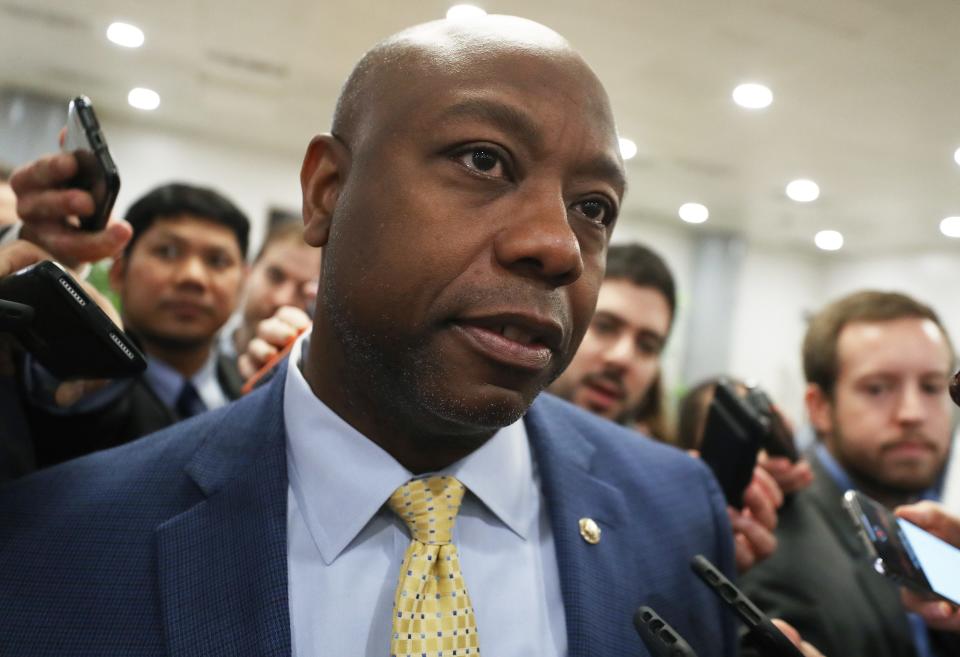 Sen. Tim Scott, R-S.C., speaks to reporters as he arrives at the U.S. Capitol, Jan. 31, 2020, in Washington.