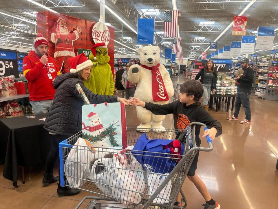 Graisen 10, greets the grinch, and the Coca Cola bear before ending his shopping spree.