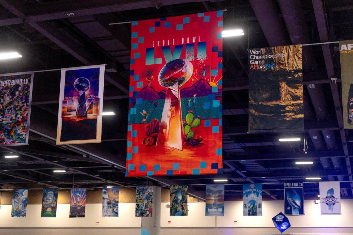 Banners representing each Super Bowl, including this year’s in Arizona, hang from the ceiling at Super Bowl LVII’s Media Row on Friday, Feb. 10, 2023, in Phoenix, Ariz.