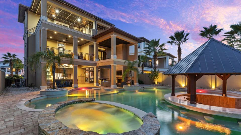 a pool in front of a house