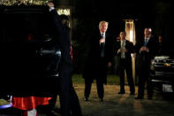 U.S. President-elect Donald Trump points to himself when asked who he is dressed as, as he arrives at a costume party at the home of hedge fund billionaire and campaign donor Robert Mercer in Head of the Harbor, New York, U.S., December 3, 2016. REUTERS/Mark Kauzlarich