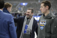 Actor Jon Hamm, center, greets players between NHL hockey All Star games Saturday, Jan. 25, 2020, in St. Louis. (AP Photo/Jeff Roberson)