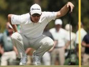 Justin Rose of Britain looks over his putt on the 17th green during first round play of the Masters golf tournament at the Augusta National Golf Course in Augusta, Georgia April 9, 2015. REUTERS/Phil Noble