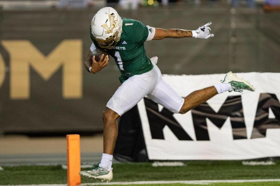 Sacramento State Hornets quarterback Kaiden Bennett (1) stumbles into the end zone for the touchdown during the first half of the NCAA football game at Hornet Stadium on Saturday.