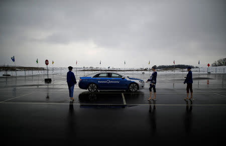 A self-driving car drives by mannequins during a demonstration at the Renesas Electronics autonomous vehicle test track in Stratford, Ontario, Canada, March 7, 2018. REUTERS/Mark Blinch