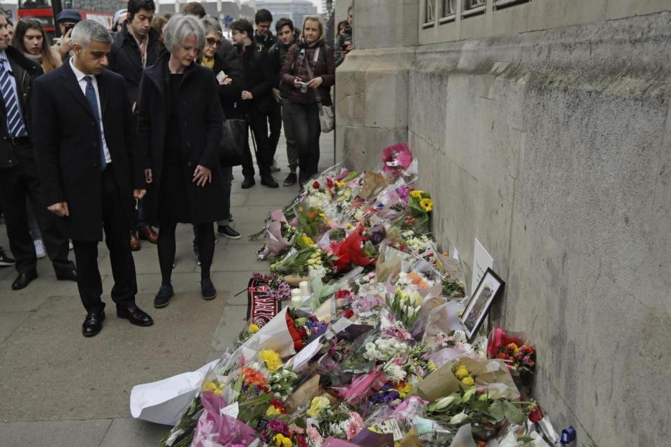 Mayor of London visits tributes layed in Westminster for the four killed and over 50 injured in Wednesday's attack (AP)