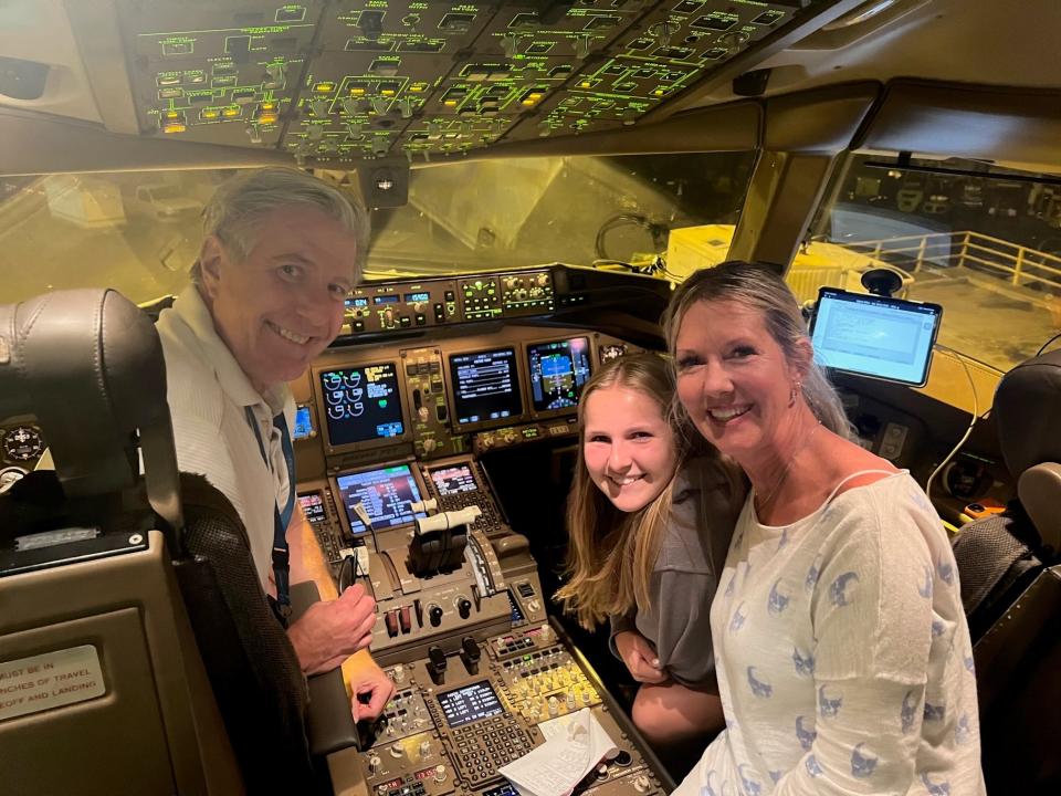 Vince Eckelkamp and his wife Kathy and daughter in the cockpit of the plane.