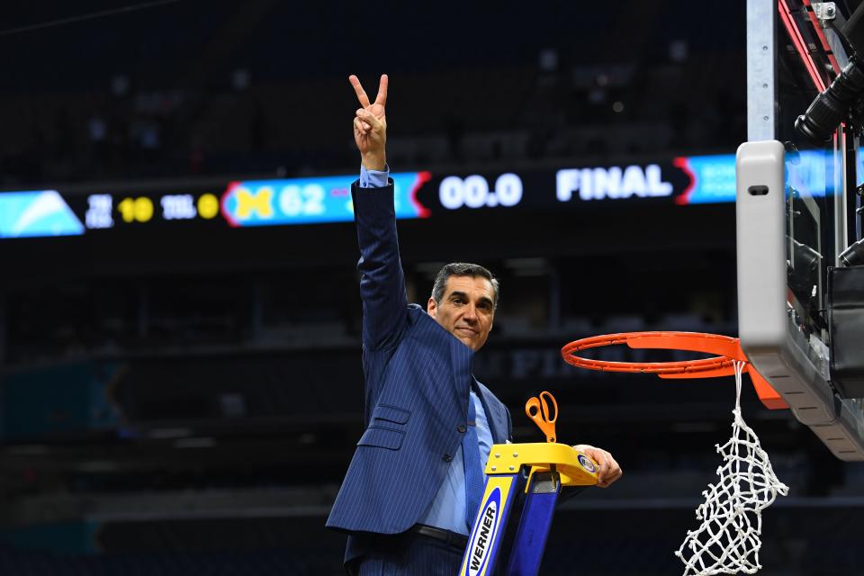 Villanova head coach Jay Wright cuts down the net after winning the 2018 national title. Wright is stepping down as the Wildcats' head coach, according to multiple reports.