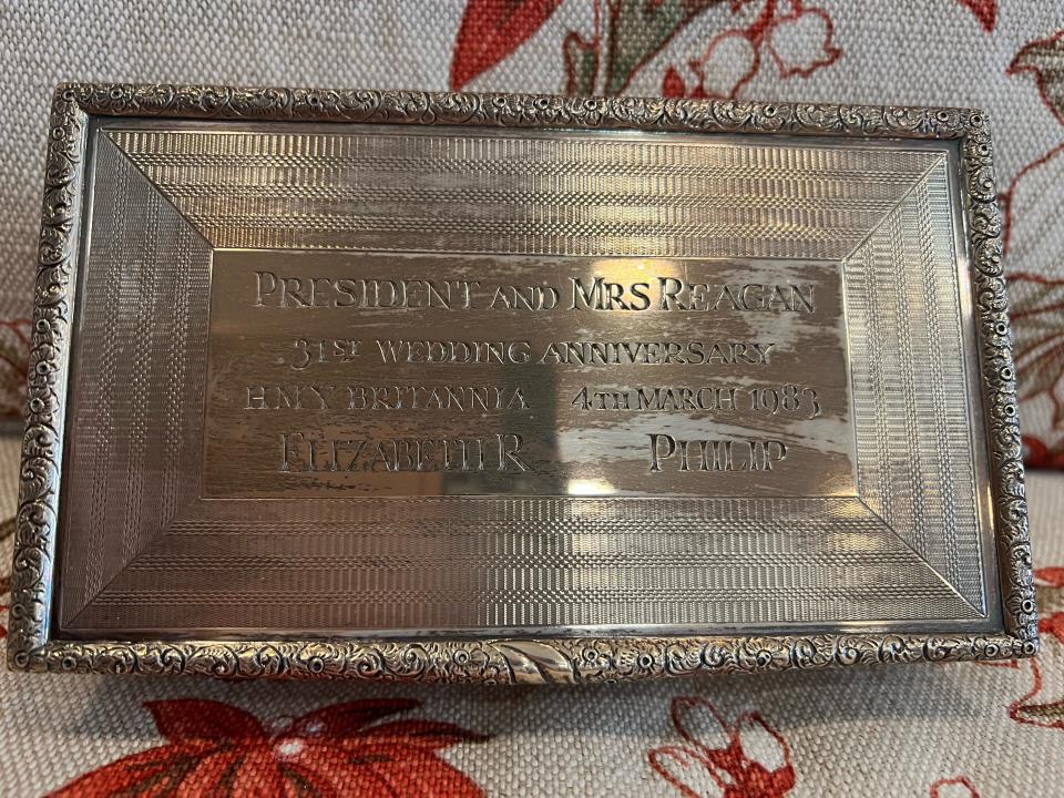 An engraved silver box given by Queen Elizabeth II to President Ronald Reagan and First Lady Nancy Reagan in honor of their 31st wedding anniversary. The queen hosted the Reagans aboard the royal yacht the Britannia which was stationed off the Santa Barbara coast on March 4, 1983. Photo provided by the Ronald Reagan Presidential Foundation and Institute.