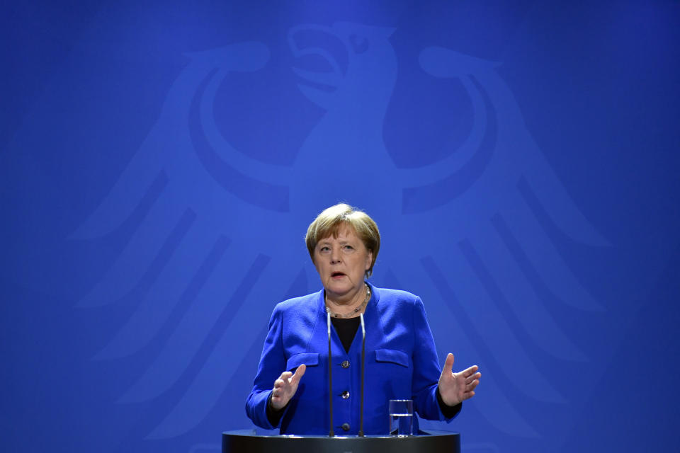 German Chancellor Angela Merkel makes a press statement on the spread of the new coronavirus COVID-19 at the Chancellery, in Berlin, Tuesday, March 17, 2020. The leaders of European Union nations have agreed to institute a travel ban that prohibits most foreigners from entering the bloc for 30 days to discourage the spread of the new coronavirus. For most people, the new coronavirus causes only mild or moderate symptoms. For some it can cause more severe illness. (John MacDougall/Pool Photo via AP)