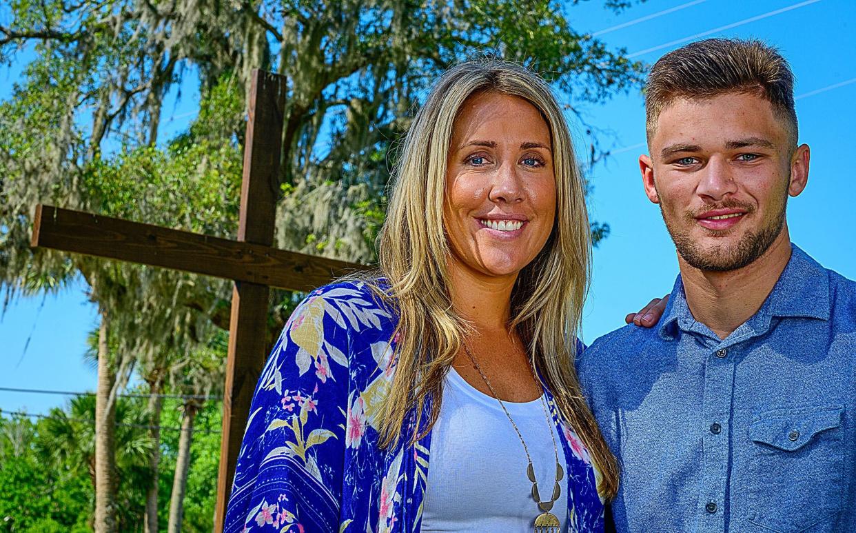 Brittany Glisson stands with her son Logan, 18, behind the St. Gerard Campus school in St. Augustine. Glisson, who was named executive director of the school and home for pregnant girls and young mothers in 2021, graduated high school from St. Gerard, when she was 17, and pregnant with Logan