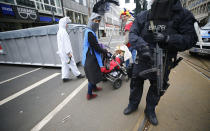 <p>Police stand guard beside costumed revelers during theRose Monday parade in Duesseldorf, Germany, Feb. 27, 2017. REUTERS/Wolfgang Rattay </p>