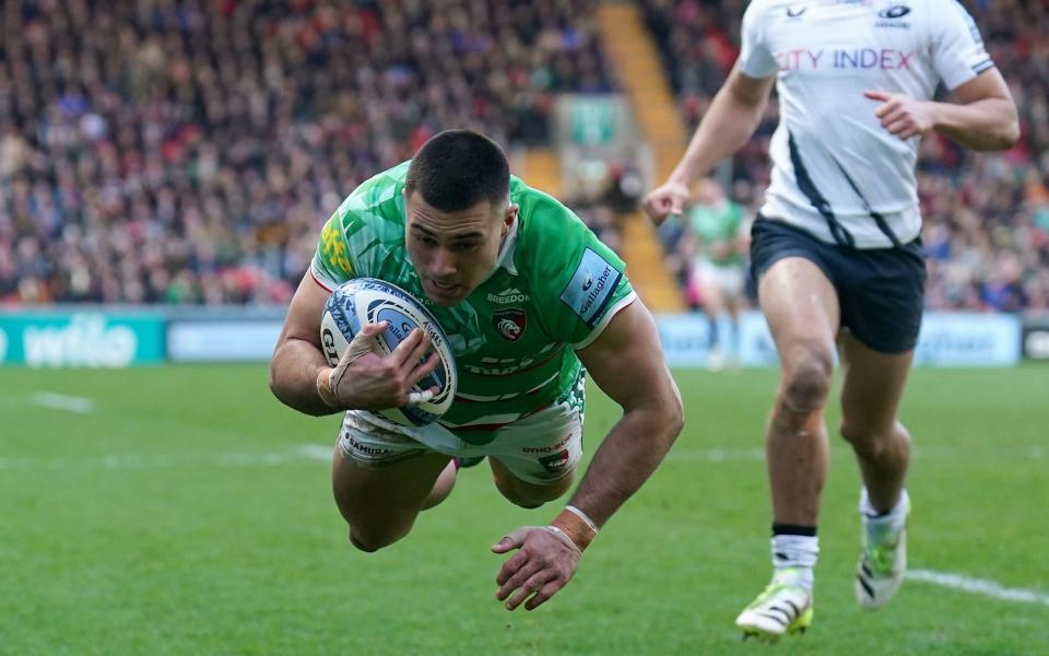 Leicester Tigers' Dan Kelly dives in to score the first try of their Premiership win over Saracens