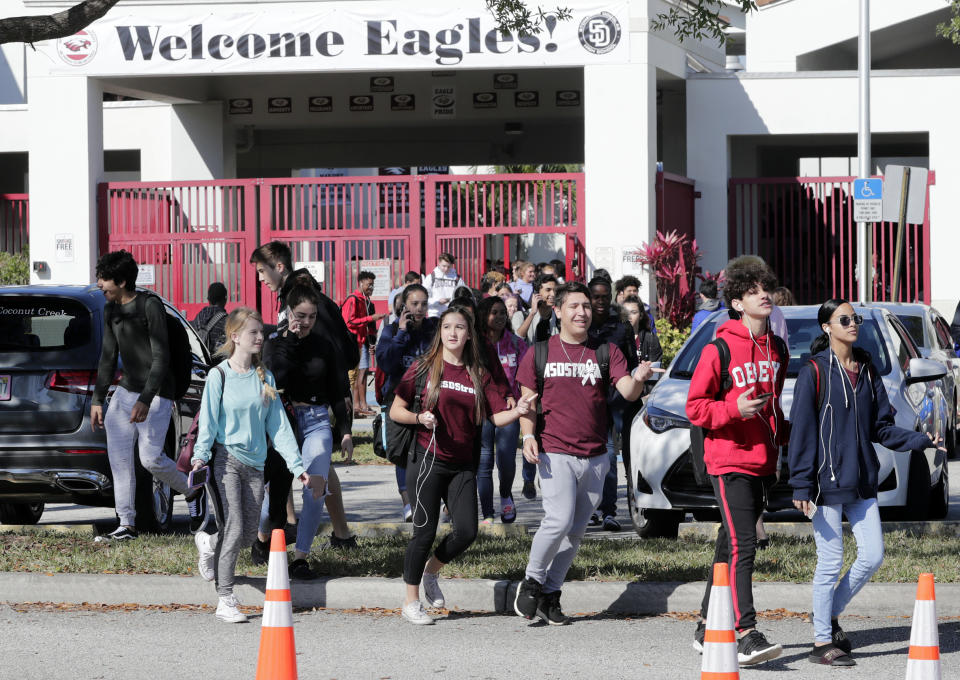 <p>Students walk out of Marjory Stoneman Douglas High School, as part of a nationwide protest against gun violence, Wednesday, March 14, 2018, in Parkland, Fla. Organizers say nearly 3,000 walkouts are set in the biggest demonstration yet of the student activism that has emerged following the massacre of 17 people at Marjory Stoneman Douglas High School in February. (Photo: Lynne Sladky/AP) </p>
