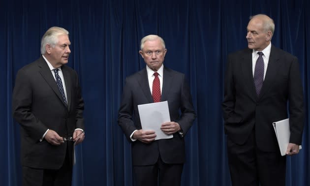 Secretary of State Rex Tillerson, Attorney General Jeff Sessions, and Homeland Security Secretary John Kelly, hold a news conference to make statements on issues related to visas and travel. Susan Walsh / AP