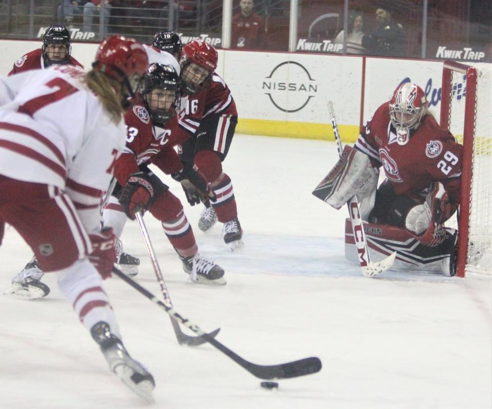 Wisconsin's Jesse Compher (7) prepares to take a shot against St. Cloud State as goalie JoJo Chobak (29) defends the play on Friday Feb. 3, 2023 at the Kohl Center in Madison, Wis.