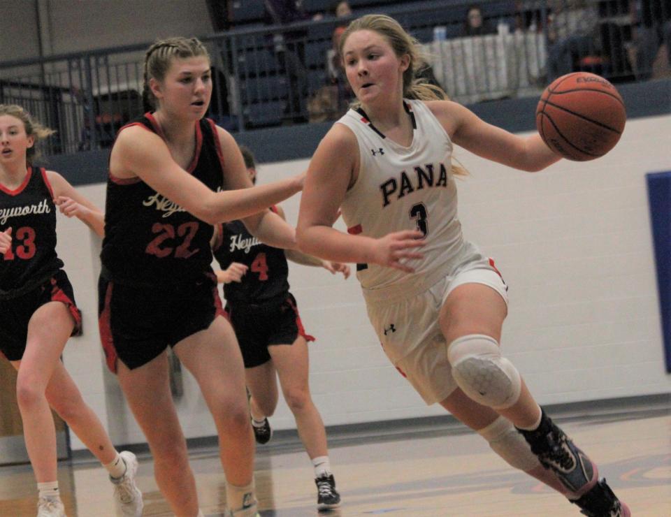 Pana senior Anna Beyers, right, drives to the basket against Heyworth during the Riverton Christmas Classic at the Hawk Center on Tuesday, Dec. 27, 2022.