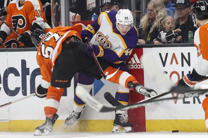 Philadelphia Flyers forward Wade Allison, left, collides with Los Angeles Kings defenseman Mikey Anderson.