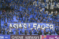 Saudi Arabia's Al Hilal fans support their team during the second leg of their AFC Champions League 2023/24 semi-final match gainst UAE's Al Ain at Kingdom Arena Stadium in Riyadh, Saudi Arabia,Tuesday, April 23, 2024. (AP Photo)