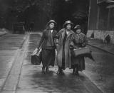 <p>A trio of women walk arm in arm shortly after British suffragette Sylvia Pankhurst (center) was released from prison. </p>