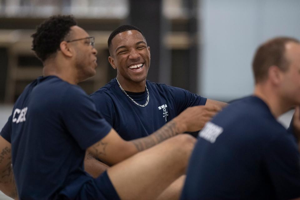 Kyle Barton, right, and Rodney Culver, recruits with the Southwestern Indiana Law Enforcement Academy, talk following a physical training class at CK Newsome Community Center in Evansville, Ind., Tuesday afternoon, April 12, 2022. 