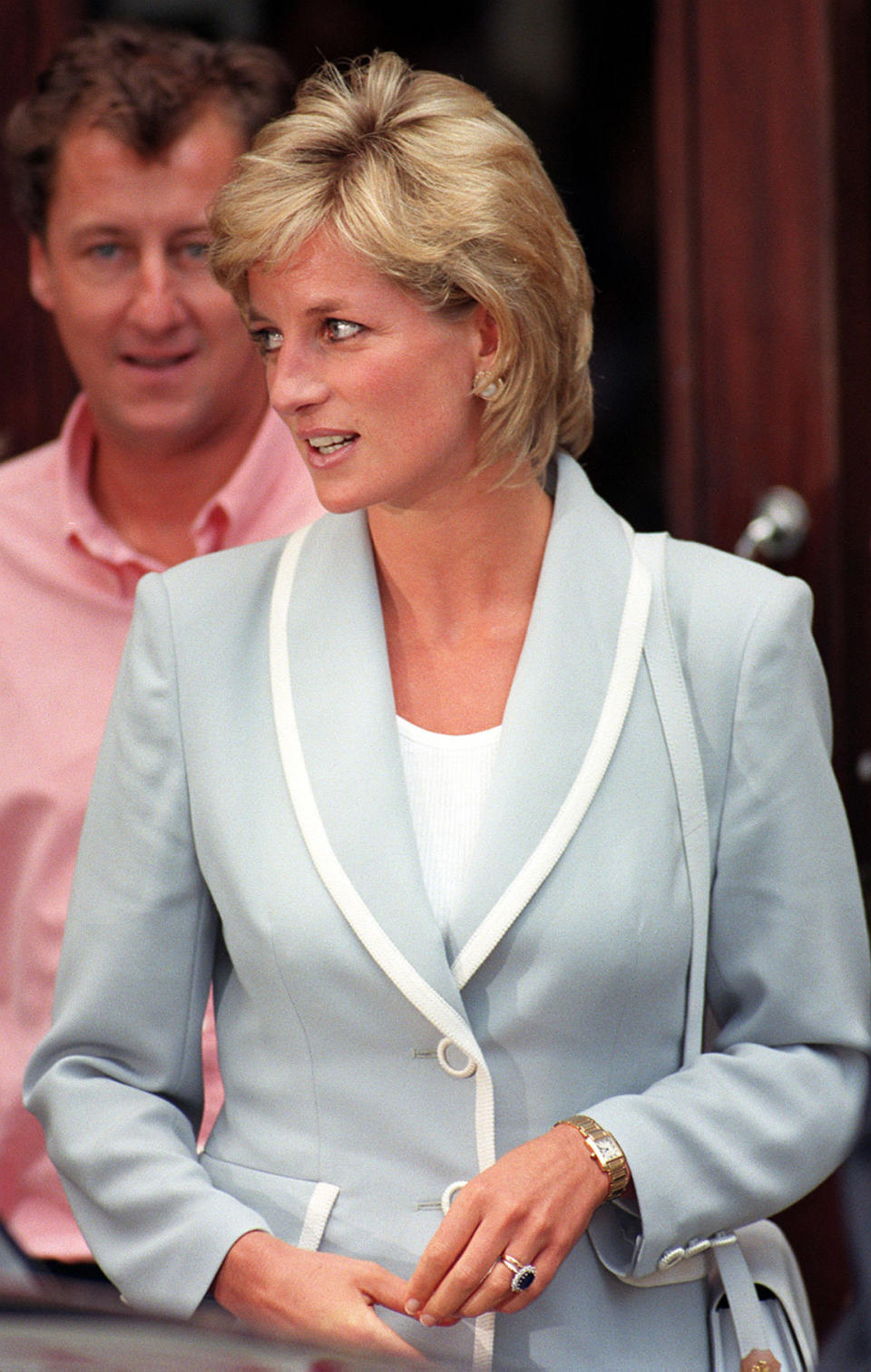 Diana, Princess of Wales, wearing her diamond and sapphire engagement ring and wedding ring, as she leaves the studios of the English National Ballet following a lunch today (Weds), on the day that her marriage to the Prince of Wales officially came to an end with the issue of the decree absolute. See PA Story ROYAL Divorce. Photo by David Cheskin.