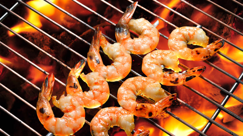 Shrimp on a fiery charcoal grill