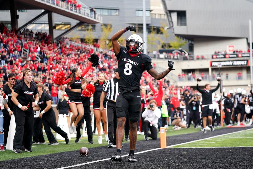 Cincinnati Bearcats wide receiver Xzavier Henderson (8) celebrates a touchdown catch against Baylor last Oct. 21 at Nippert Stadium.