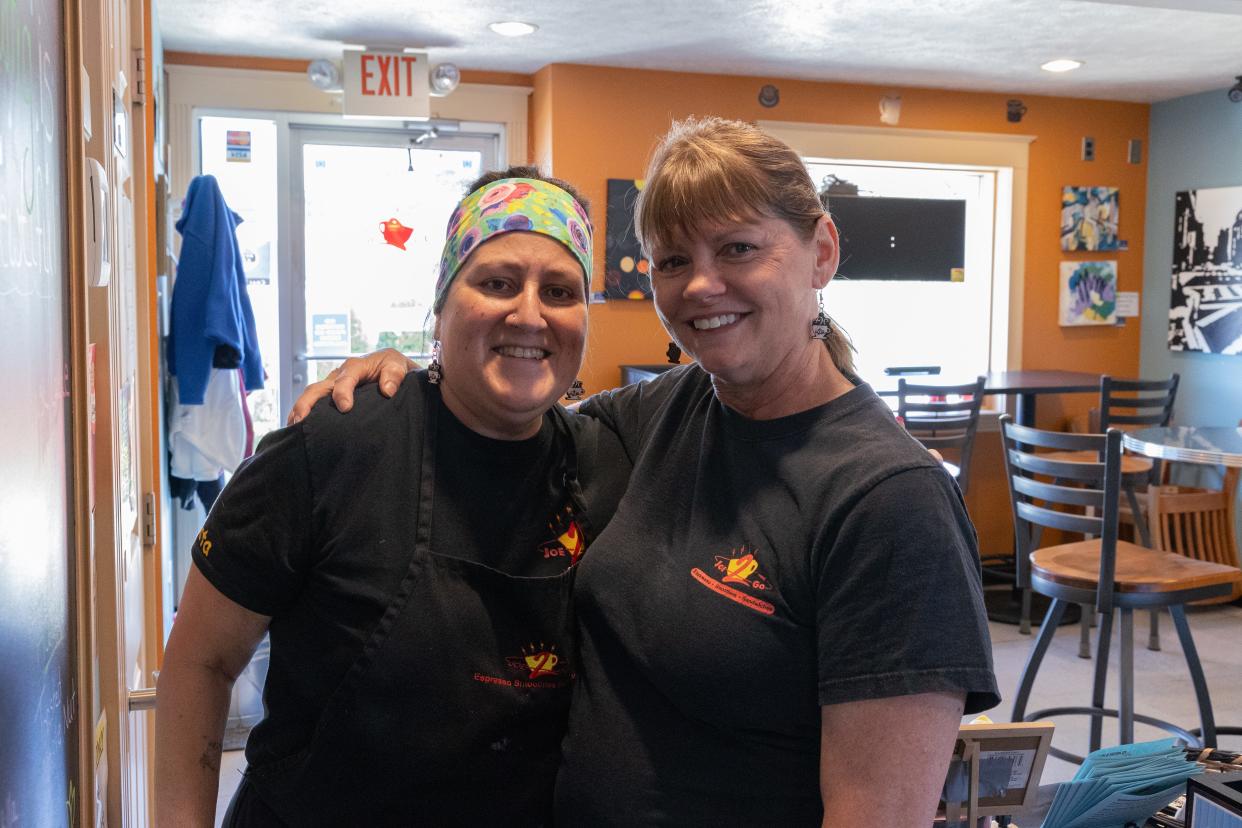 Lisa Homik, owner of Joe2Go, and Don Goodemoot, an employee of seven years, pose for a photo Tuesday, April 16.