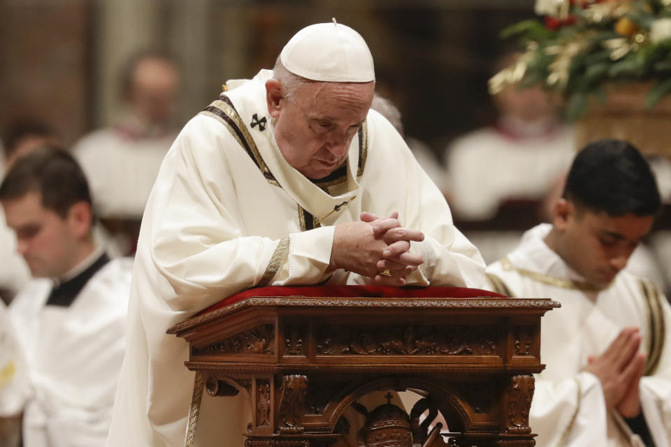 Pope Francis prays as he celebrates Christmas Eve Mass in St. Peter's Basilica at the Vatican, Tuesday, Dec. 24, 2019. (AP Photo/Alessandra Tarantino)