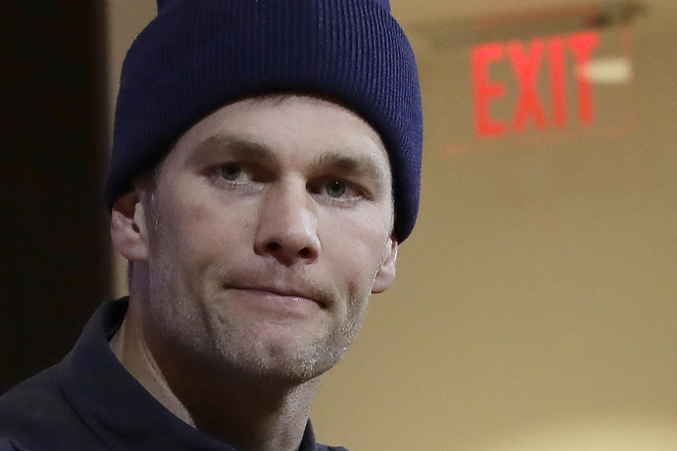 FILE - In this Jan. 4, 2020, file photo, New England Patriots quarterback Tom Brady listens to a question at his post-game news conference after the Patriots lost to the Tennessee Titans in an NFL wild-card playoff football game in Foxborough, Mass. Brady said on social media, Friday, March 20, 2020, he has signed with with the Tampa Bay Buccaneers. (AP Photo/Elise Amendola, File)