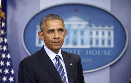 U.S. President Barack Obama listens as he participates in his last news conference of the year at the White House in Washington, U.S., December 16, 2016. REUTERS/Carlos Barria