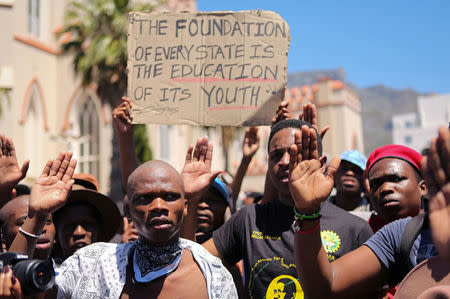 Students protest outside the parliament ahead of South African Finance Minister Pravin Gordhan's medium term budget speech in Cape Town, South Africa October 26, 2016. REUTERS/Sumaya Hisham