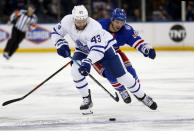 Toronto Maple Leafs' Kyle Clifford (43) skates up ice with New York Rangers' Greg McKegg (14) in pursuit during the first period of an NHL hockey game Wednesday, Jan. 19, 2022, in New York. (AP Photo/John Munson)