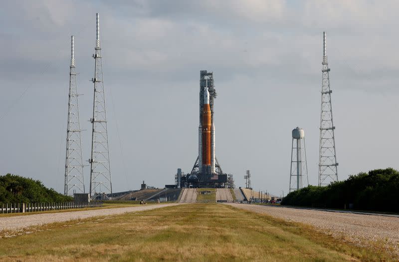 FILE PHOTO: NASA's next-generation moon rocket, the SLS Artemis 1 rocket with its Orion crew capsule perched on top, leaves the Vehicle Assembly Building