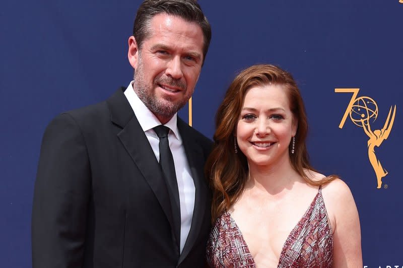 Alexis Denisof and actress Alyson Hannigan attend the Creative Arts Emmy Awards at the Microsoft Theater in Los Angeles in 2018. File Photo by Gregg DeGuire/UPI