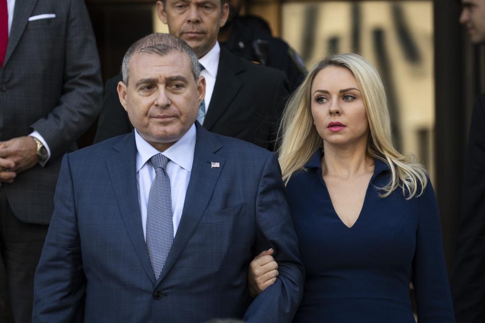 Images shows Lev Parnas (L) and his wife Svetlana Parnas leaving Manhattan federal court in New York City after a criminal arraignment on October 23, 2019.  (Photo by Drew Angerer/Getty Images) ORG XMIT: 775423222 ORIG FILE ID: 1177748124