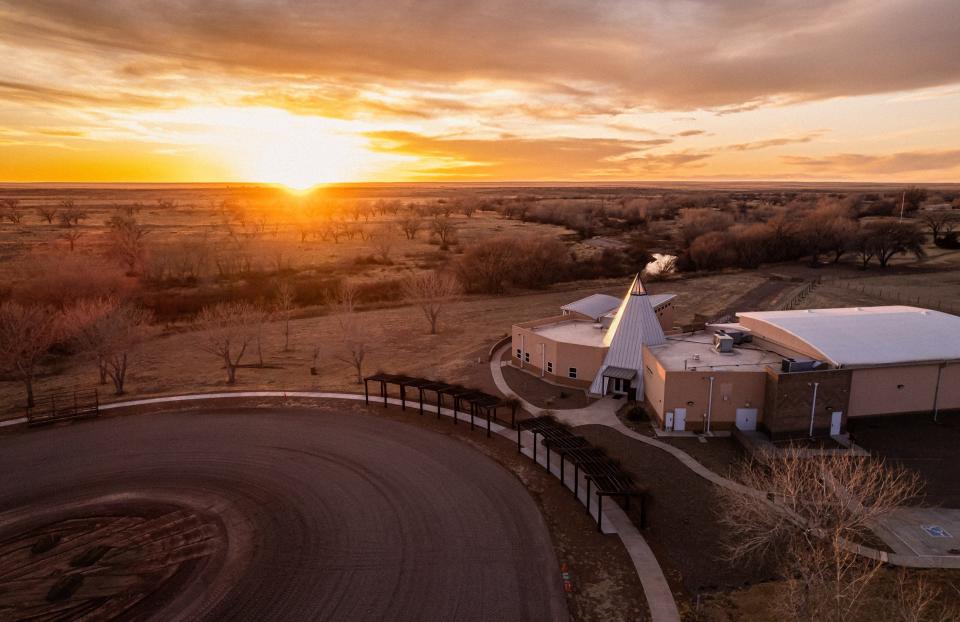 The building and grounds of Bosque Redondo Memorial at Fort Sumner Historic Site, captured at sunset.